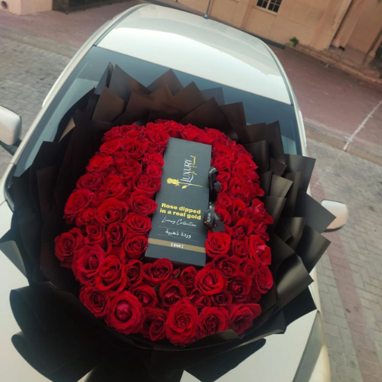 100 Red Roses and Golden In the middle on the car